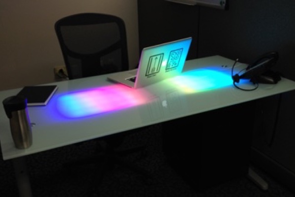 Photo of glass desk with embedded network controlled LED lighting